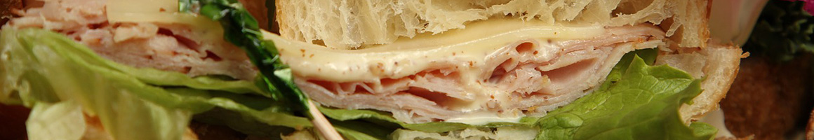 Eating Sandwich at 101 Bagels & Subs restaurant in Oceanside, CA.